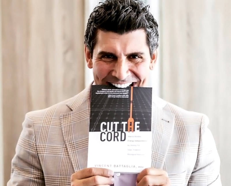 Vincent Battaglia holding a copy of Cut the Cord